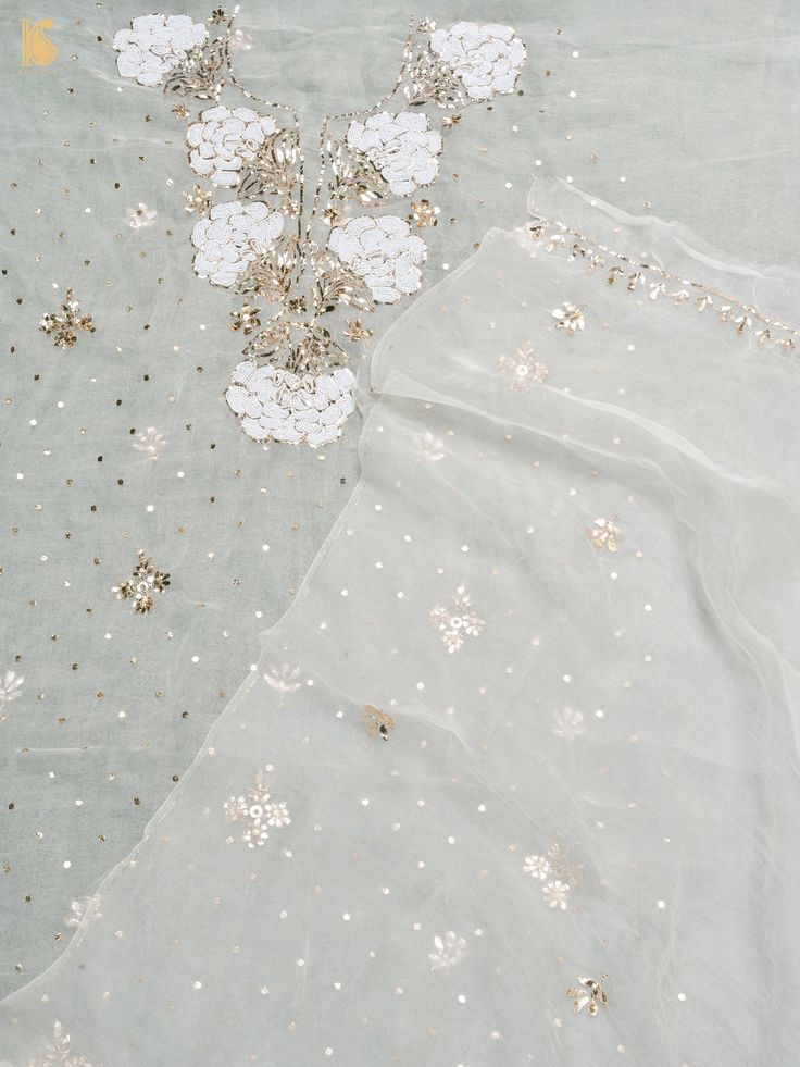 Explore Khinkhwab's exquisite collection featuring the timeless allure of Lucknowi Chikankari work. Originating from the Mughal era, this ancient embroidery style is among Lucknow's most revered art forms. Each piece, meticulously handcrafted, showcases intricate floral motifs in delicate white thread on fine muslin, embodying timeless elegance and cultural heritage. Transitional Tissue Silk Kurta With Zari Work, Festive Tissue Silk Kurta With Zari Work, Transitional Tissue Silk Kurta With Dupatta, Designer Tissue Silk Kurta With Zari Work, Cotton Silk Saree With Mirror Work For Eid, Silk Kurta With Chikankari Embroidery For Diwali, Eid Cotton Silk Saree With Mirror Work, Traditional Cotton Silk Kurta With Mirror Work, Tissue Silk Straight Kurta With Mirror Work