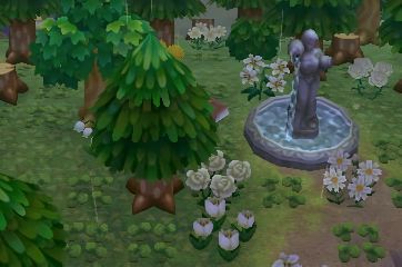 an animated image of a fountain in the middle of a park with trees and flowers