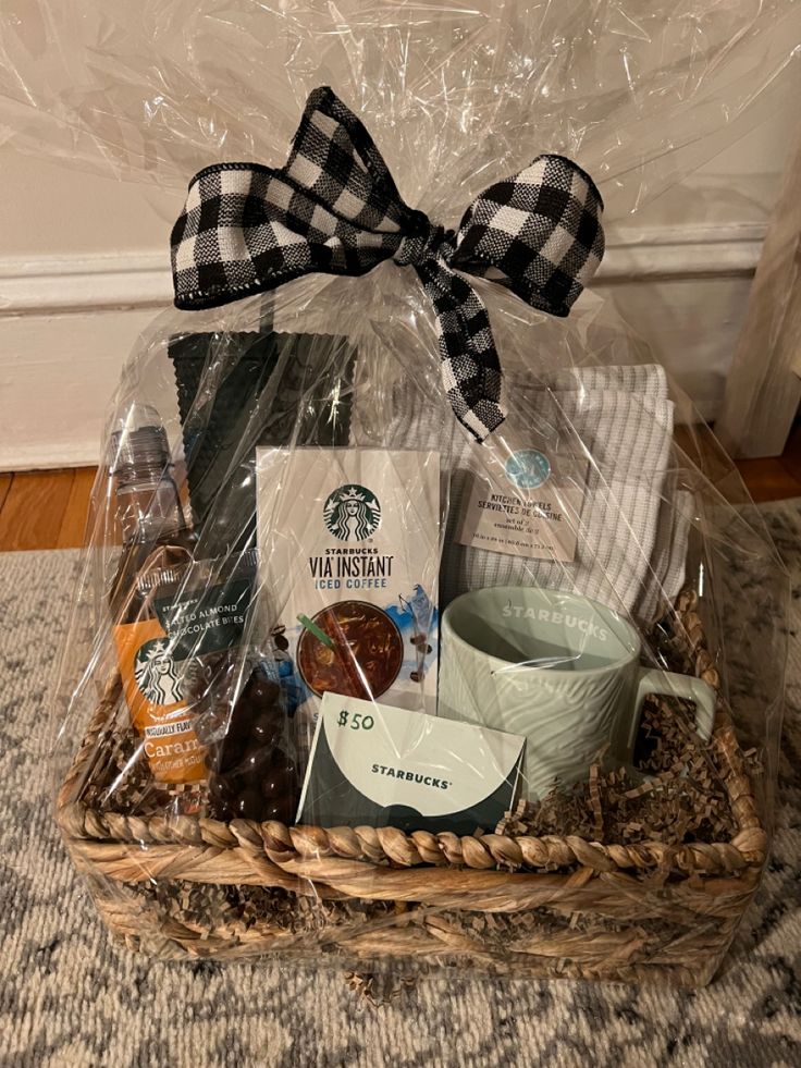 a basket filled with coffee, cookies and other items