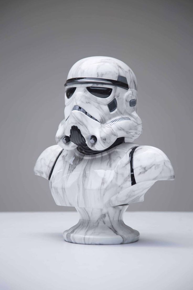 a white storm trooper figurine sitting on top of a table