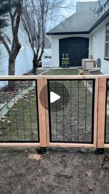 a dog gate in front of a house