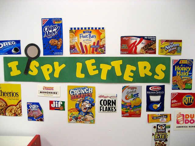 a bulletin board that has various cereals on it and the words, i spy letters