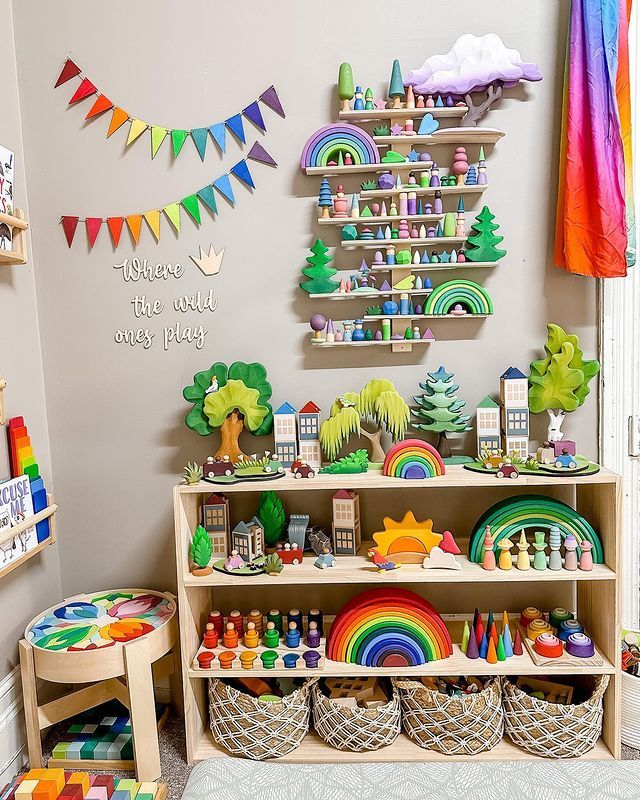 a child's playroom with toys and decorations on the shelves, including rainbows