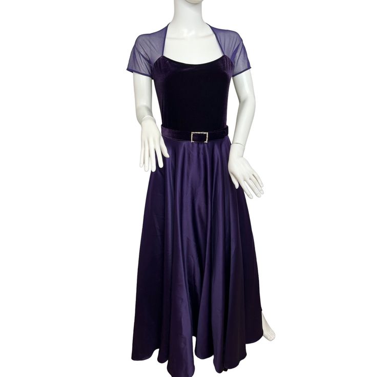 "0913A- JS Collections Women's Purple gown 8 Vintage, Fit & Flare made in Canada, 90% polyester, 10% spandex, dry, clean, only, see-through shoulders, short sleeve, round neck, velvet top, with matching velvet belt, 1.25.\" Wide, with rectangular round rhinestones buckle loop. Polyester from the waist down. Looks like satin. Has a beautiful sheen. Back zipper and buttons closure. Lined, and has black organza overlay over the lining.18\" shoulder to shoulder, 34\" armpits, 32\" waist, 55\" hips, 1980s Prom Dress, 1980s Prom, Match Velvet, Purple Gowns, Purple Shorts, Ladies Gown, Velvet Tops, Fit & Flare, Formal Event