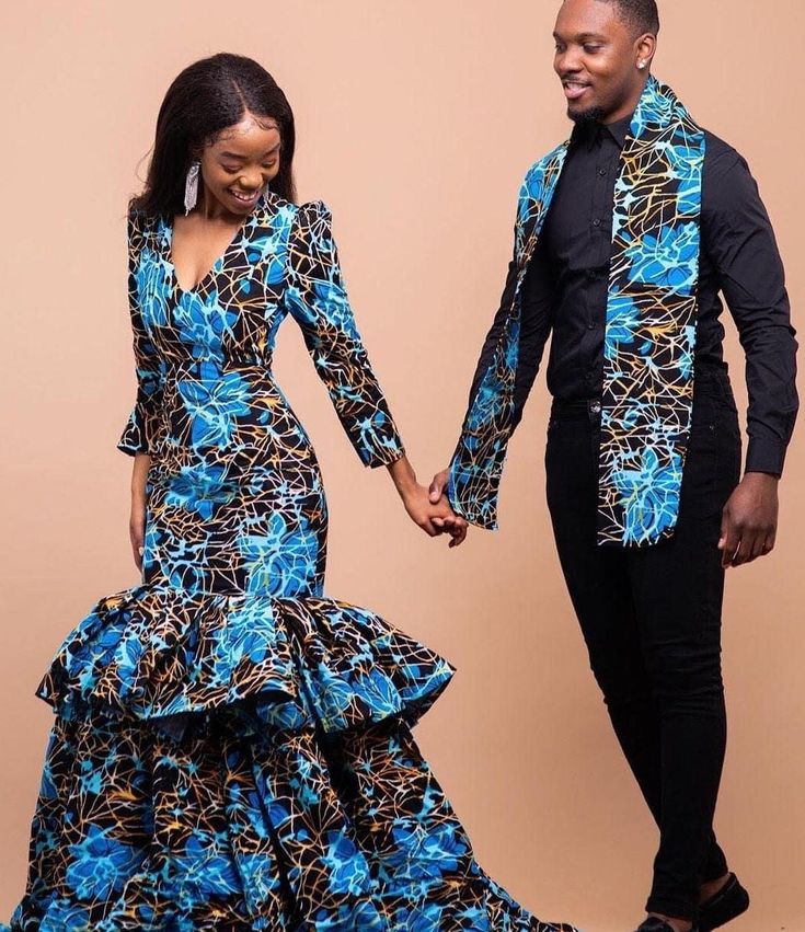 "The AvaApparel matching couple outfit is the piece your wardrobe's been waiting for. Perfect for all occasions including weddings, anniversaries, and proms.  The Ankara fabric used is 100% cotton and this is a custom-made order. Please swipe to see all available prints, in case you need more fabric options aside from what has been listed, please send us a message. It will be made to suit your selected size, kindly send in your body measurements for a perfect fit for you. The design can be altered to your liking, please feel free to start an Etsy conversation with us.    For Men, we need measurements for: Chest arm length  pant length  waist hips shoulder length shirt length  For Women, we need measurements for: Bust  Underbust  Waist  Hips  Dress Length, shoulder to the floor or where you Prom Couples Outfits, Matching Couple Outfit, African Couple, Weddings Dress, Anniversary Outfit, Printed Prom Dresses, Cold Shoulder Maxi Dress, Ankara Dresses, African Print Dress