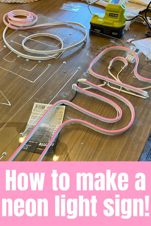 a wooden table topped with lots of neon colored cords and wires on top of it