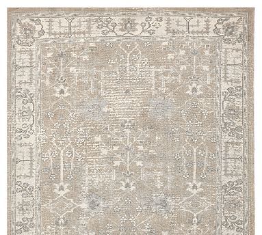 an antique rug with many different patterns and colors on the carpet, including beiges