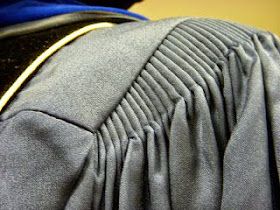 a close up view of the back of a person's jacket