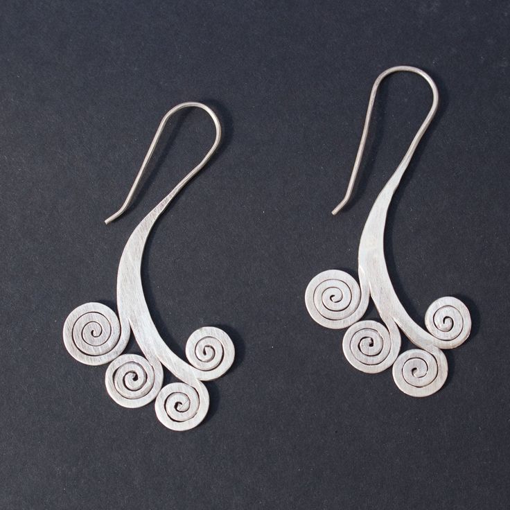 Sterling silver spiral earrings Approximate dimensions; L 2.5 X W 1.25 inches Silver Spiral Wrap Earrings In Sterling Silver, Unique Sterling Silver Swirl Earrings, Nickel Free Silver Swirl Earrings, Sterling Silver Swirl Earrings, Silver Swirl Sterling Silver Earrings, Silver Spiral Wrap Earrings, Pierced, Unique Silver Swirl Earrings, Unique Silver Spiral Earrings, Unique Spiral Silver Earrings