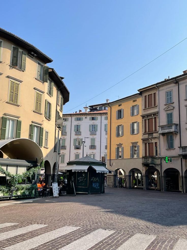 an empty square in the middle of some buildings