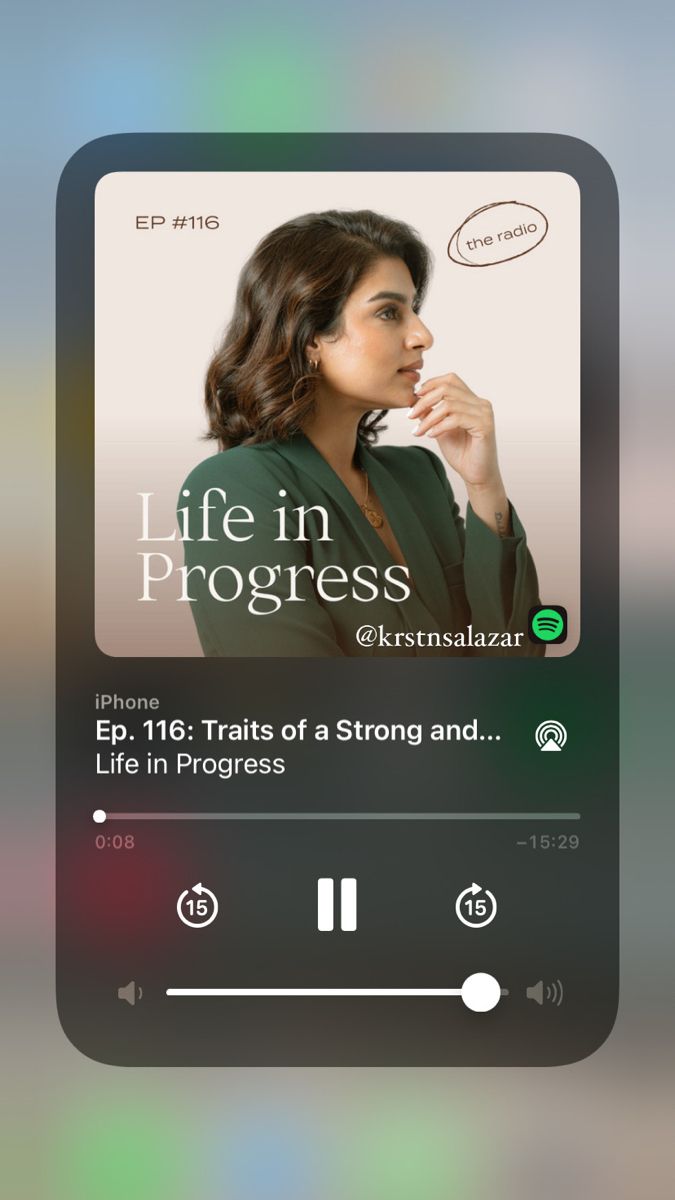 an mp3 player with the words life in progress on it's screen, and a woman