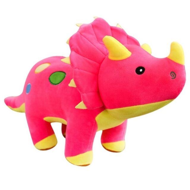 a pink and yellow stuffed animal that looks like a trilops head with green eyes