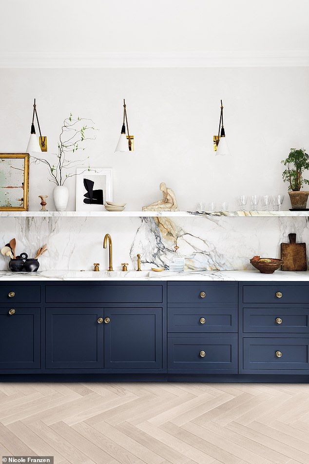 the instagram page shows an image of a kitchen with blue cabinets and marble counter tops