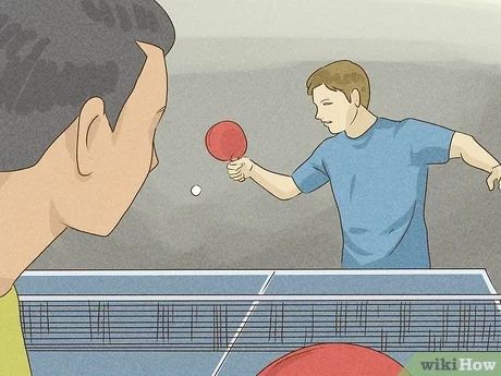 a man is playing ping pong with another man