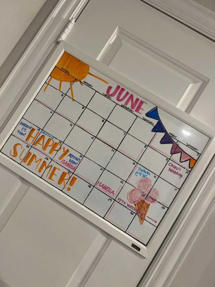 a door with a calendar on it and bunting flags attached to the front door