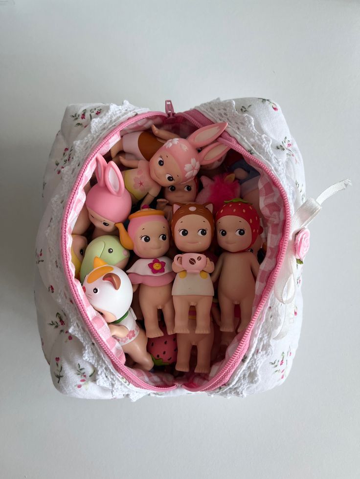 a bag filled with lots of small toy figurines