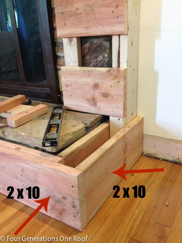 the bed frame is made out of wood and has 2x10 drawers on each side