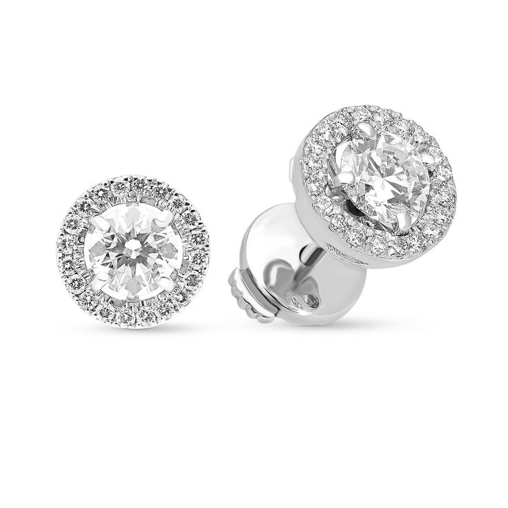 A special look, these diamond stud earrings elevate her attire. Crafted in cool 18K white gold, each earring features a 0.50ct. brilliant cut diamond - artfully set to enhance size and sparkle - wrapped in a stepped frame of smaller diamonds. Shimmering with 1.27 ct. t.w. of diamonds and a brilliant buffed luster, these post earrings secure comfortably with a protector squeeze back. 
0.51 carat E VS2
0.52  carat E SI1
0.24 carat diamonds pave setting
18k white gold Emerald Earrings Drop, Orange Sapphire, Diamond Stud Earrings, Pave Setting, Tennis Bracelet Diamond, Salt And Pepper Diamond, Diamond Stud, Lovely Jewellery, Diamond Halo