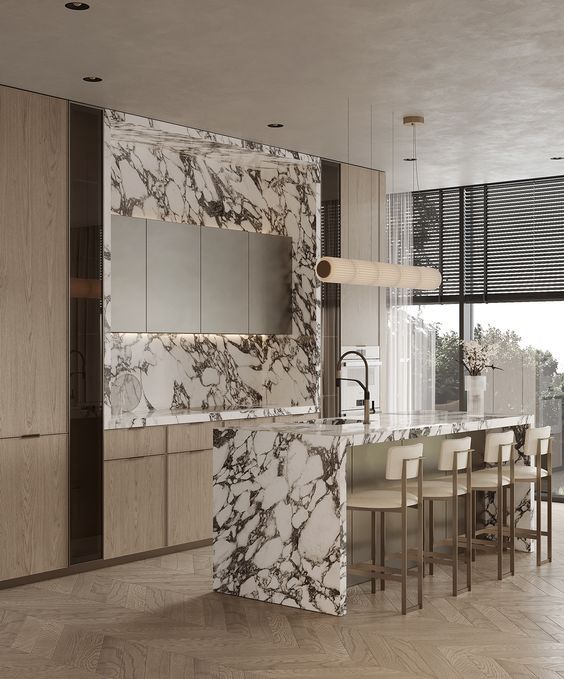 a kitchen with marble counter tops and wooden cabinets in the center, along with beige chairs