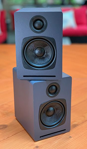 two speakers are stacked on top of each other