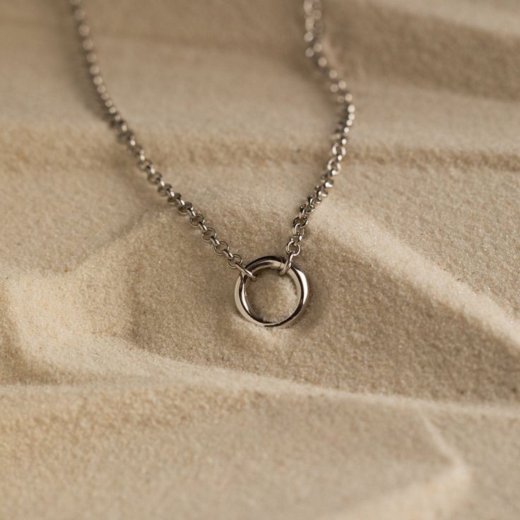 Introducing our Minimalist Circle Necklace, designed with a distinctive Rolo Link Chain that effortlessly exudes a charming and minimalist look. Its versatile hinged circle can be easily detached, offering the freedom to customize your style as you see fit ♡ Layer it with any other necklace or chain of your choice as its simple, yet classic style makes it a staple piece for both casual and formal occasions! SKU: RR-NR146 Product Details Material: High Quality Solid 925 Sterling Silver Finish: St Delicate Everyday Jewelry With Spring Ring Clasp, Everyday Stainless Steel Hoop Jewelry, Stainless Steel Jewelry With Delicate Chain And Round Pendant, Dainty Clavicle Chain With Open Circle Pendant, Classic Sterling Silver Full Circle Jewelry, Dainty Open Circle Clavicle Chain Jewelry, Everyday White Gold Clavicle Chain Jewelry, Classic Circular Sterling Silver Jewelry, Everyday White Gold Jewelry With Clavicle Chain