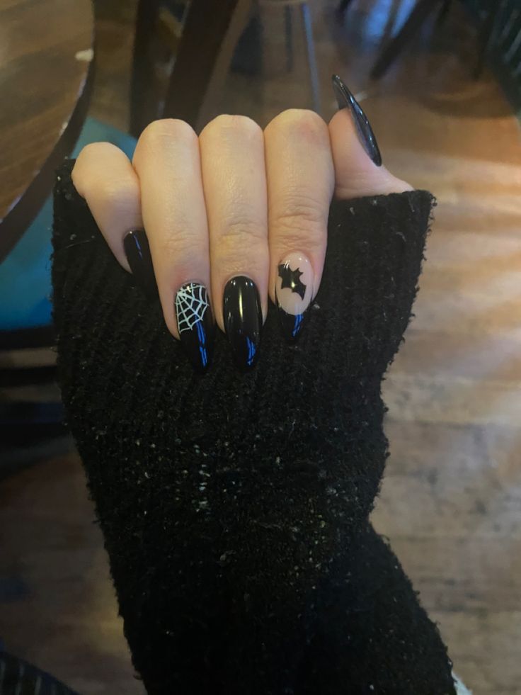 spooky halloween nails i got with a bat and a spiderweb, im obsessed! #goth #bat black nails #black #nails #spiderweb #emo #nails Black Spider Web Nails Coffin, Nails With Bats On Them, How To Do A Spider Web On Nails, Spooky Nails Coffin Shape, Halloween Spiderweb Nails, Simple Goth Nail Art, Halloween Nails Cobweb, Band Acrylic Nails, Simple Goth Nails Almond