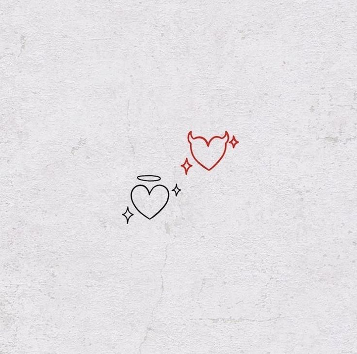 two hearts drawn on the side of a white wall next to an arrow and star