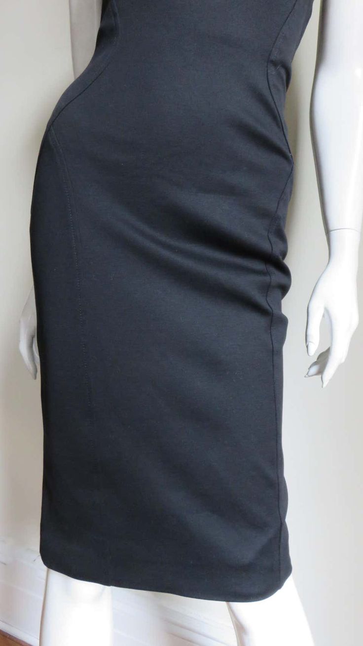 For Sale on 1stDibs - A fabulous black silk jersey strapless dress from Gianni Versace Couture. It is fitted with flattering seaming and the center back has functional on the Sleek Fitted Evening Pencil Skirt, Modern Black Pencil Skirt For Evening, Sleek Fitted Skirt For Gala, Modern Fitted Skirt For Evening, Black Sleek Pencil Skirt For Formal Occasions, Sleek Black Pencil Skirt For Formal Occasions, Luxury Fitted Cocktail Skirt, Elegant Stretch Pencil Skirt For Evening, Modern Fitted Pencil Skirt For Formal Occasions