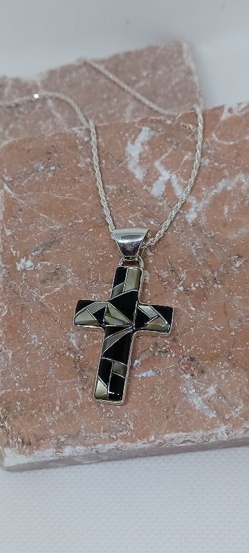 Handcrafted Small Cross Pendant Necklace with Gemstones Inlay Cross size = 1" wide x 1 3/8" high Gemstones: Black Onyx, Black Lip (seashell S. Pacific) Solid Sterling Silver will not tarnish 18" Sterling Silver chain with lobster clasp Black Inlay Jewelry As A Gift, Black Jewelry With Inlay For Gift, Black Symbolic Cross Pendant Necklace, Black Engraved Pendant Jewelry, Black Sterling Silver Jewelry With Large Pendant, Spiritual Onyx Cross Jewelry, Black Symbolic Cross Pendant Jewelry, Black Sterling Silver Symbolic Jewelry, Black Symbolic Necklace With Large Pendant