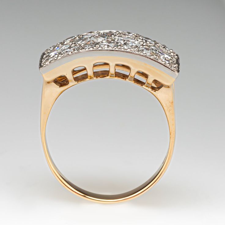 This sparkling platinum topped 14K yellow gold ring features seventeen (17) bead set round brilliant cut diamonds, and one (1) bead set old European cut diamond. The ring measures 13.7mm at the top, rises 6.0mm above the finger, tapering to 3.2mm wide and 0.9mm thick at the base of the shank. It is currently a size 8.75. Bead Set, European Cut Diamonds, Yellow Gold Ring, Gold Platinum, Round Brilliant Cut Diamond, Brilliant Cut Diamond, Yellow Gold Rings, Round Brilliant, Gold Ring