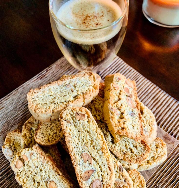 some cookies are sitting on a table next to a glass of beer