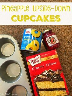 some cupcakes are sitting on the counter next to an empty muffin tin