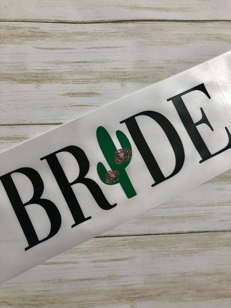 the bride sticker is on top of a white wooden table