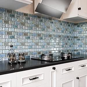 a kitchen with white cabinets and black counter tops is pictured in this image, there are pots and pans on the stove