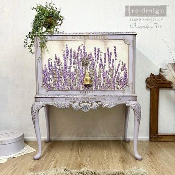 an old fashioned bench with lavender flowers on it