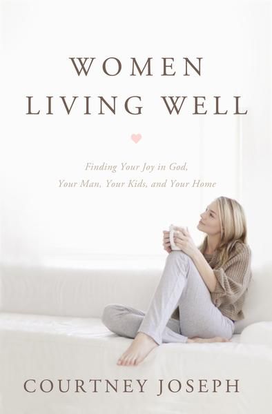 a woman sitting on top of a white couch next to a pink and beige book cover