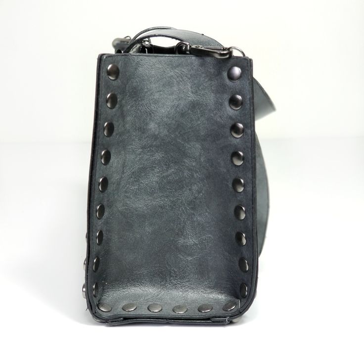 The Liz Bag. Crossbody bag. Casual rocker style bag. Studded. Zipper closure. Grey. Imported. Edgy Rectangular Bags For Everyday Use, Edgy Rectangular Shoulder Bag For Daily Use, Edgy Leather Rectangular Shoulder Bag, Edgy Shoulder Bag With Zipper Closure For Concert, Edgy Rectangular Leather Shoulder Bag, Edgy Shoulder Bag With Zipper For Concert, Edgy Rectangular Travel Shoulder Bag, Edgy Rectangular Shoulder Bag For Travel, Punk Style Leather Bags For Daily Use