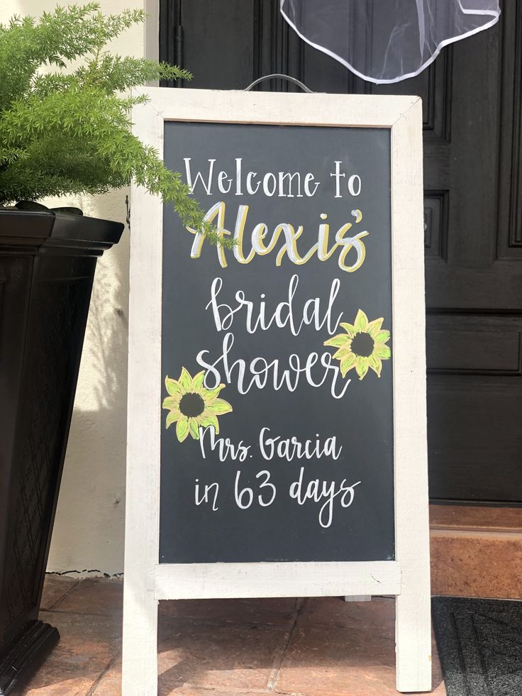 a chalkboard sign that says welcome to alexis and bridal shower, mrs gaura in 65 days