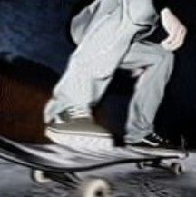 a man riding a skateboard down the side of a ramp