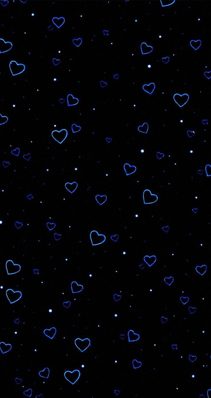 blue hearts on a black background with white dots in the middle and small stars at the bottom