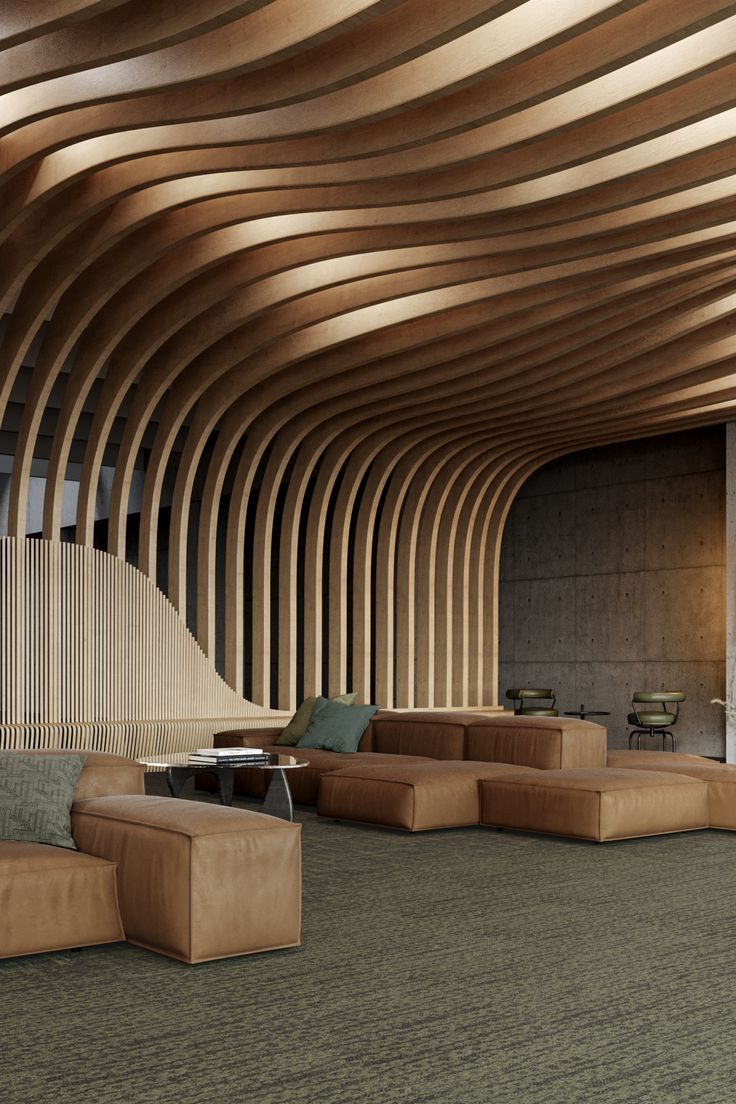 a large room with couches, tables and lamps on the ceiling is made of wood