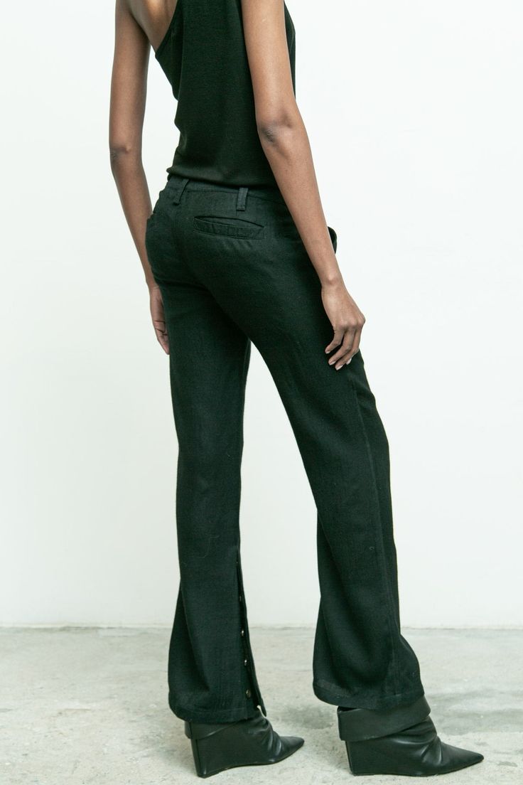 100% wool/ wide leg pant/ side slits with button closure/ belt loops/ front and back pockets/ zipper closure/ runs large, size down for fitted or actual size for slouch fit Judy is 5'10" size 2 wearing size 2 Tailored Fall Pantsuit With Belt Loops, Fitted Wide-leg Work Pants For Fall, Full Length Dress Pants With Belt Loops For Fall, Wool Wide Leg Dress Pants With Belt Loops, Wide Leg Wool Dress Pants With Belt Loops, Tailored Wide-leg Pantsuit With Belt Loops, Wool Wide-leg Dress Pants With Belt Loops, Fall Wool Wide Leg Pants, Chic Wool Wide Leg Pants With Straight Hem