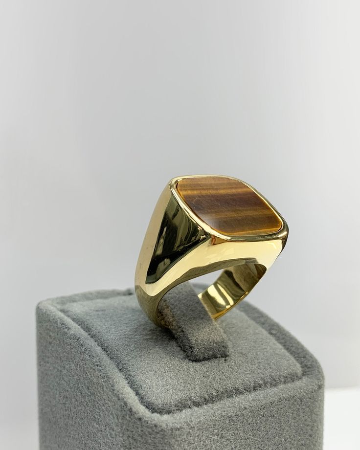 Men Ring with Tiger Eyes Gemstone, Brown Pinky Signet Ring, Square Shape, Stylish Gold / Silver Ring, Handmade Jewelry, Best Gift for Him ◎ Details ◎ ○ Material 14K Solid Gold or 925 Sterling Silver Weight of Ring : approx 18.00 gr Height of Ring : approx 5.30 mm ○ Upgrade to Solid 18K Gold, please click the link below: https://www.etsy.com/listing/962826004 ○ Gemstone Natural Tiger Eyes approx. 15 mm x 15 mm 4.00 ct Made to Order HANDMADE ITEM ○ For Men Collection : https://etsy.me/2PmKJMW All Classic Gold Signet Ring With Gemstone, Fine Jewelry In 14k Gold, Brown, Fine Jewelry In 14k Gold With Brown Color, Fine Brown 14k Gold Jewelry, Classic Brown Hallmarked Rings, Brown Gemstone Rings In 14k Gold, Formal 14k Gold Brown Jewelry, 14k Gold Jewelry With 17 Jewels, Classic Brown Signet Ring