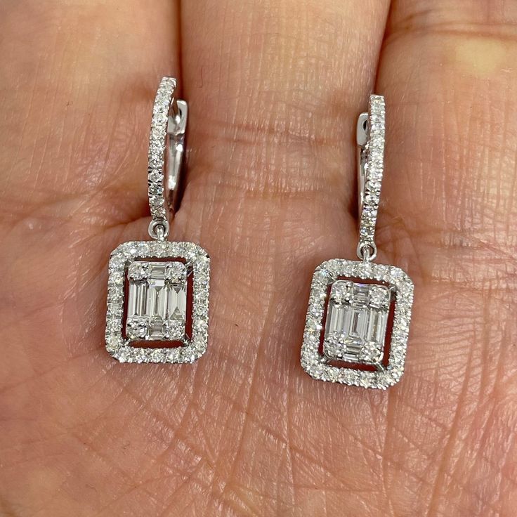 Beautiful Diamond Drop Earrings set with white and sparkling diamonds.  The center cluster of diamonds are set together to look like a solitaire emerald cut diamond.  Just dangles below the lob, not too long.  These stunning earrings are classy and so pretty.  The hoop earring fits nice around the lobe.  These earrings you can easily dress up or down in them.  Excellent craftsmanship, all diamonds set smooth.  Measures about 24 x 8.2mm.  The dangle measures about 10.1x8.2mm.  The hoops snaps tig Formal Diamond Drop Earrings, Long Drop Earrings Diamonds, Dangling Diamond Earrings, Simple Diamond Earrings, The Lob, Ear Piercings Industrial, Duck Wallpaper, Diamond Dangle Earrings, Earrings Diamond