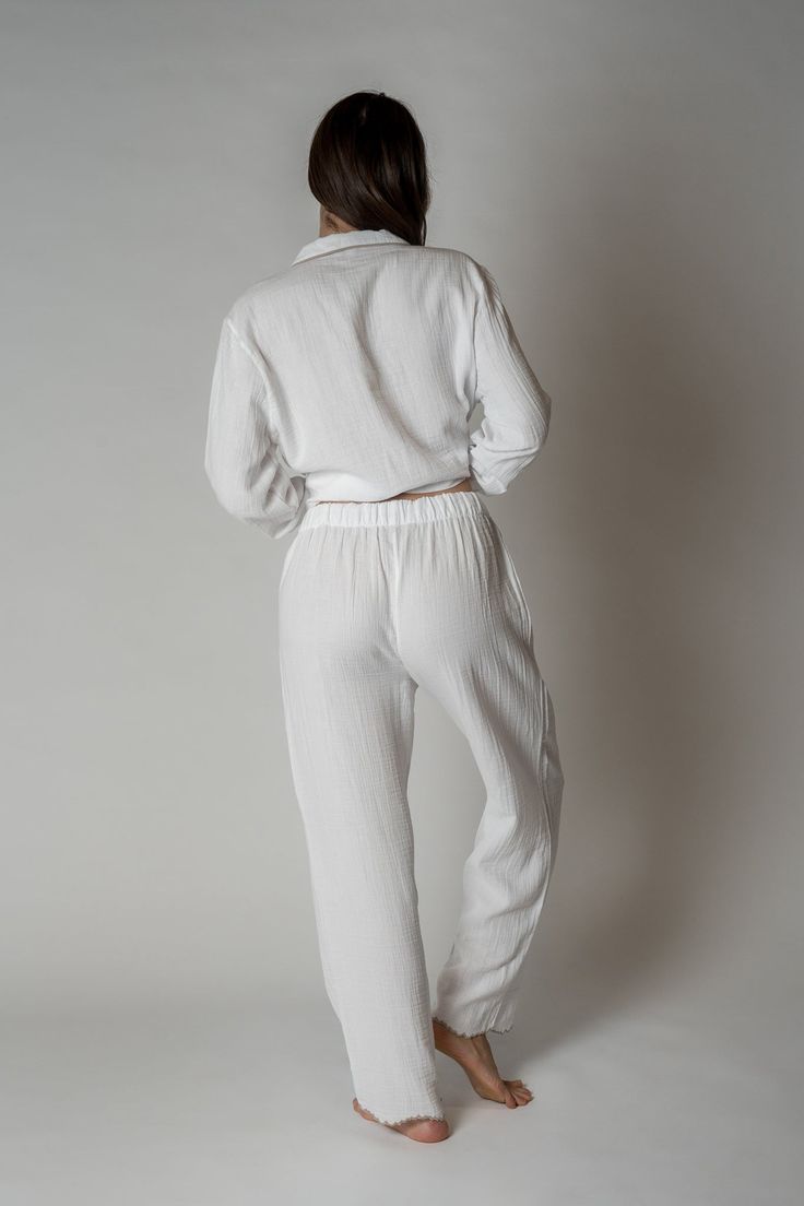 FINAL SALE Made with 100% organic combed cotton, the Alaia Pajama Set is stylish, comfy, and sustainable, making them the perfect addition to any sleepwear collection. With a unique scalloped trim for a touch of sophistication. Relaxed silhouette top Button front Scalloped edges at wrists and ankles One chest pocket Drawstring waist Organic Gauze Kristen is 5'9" and is wearing a size S/MSizes S/M and L/XL. See size guide for sizing recommendations. Solid Cotton Sleepwear For Lounging, Cotton Sleepwear With Elastic Waistband And Long Sleeves, Solid Cotton Loungewear Sets, Relaxed Fit Cotton Sleepwear For Lounging, Spring Sets With Relaxed Fit, Solid Color Relaxed Fit Loungewear Sets, Cotton Sleepwear For Loungewear, Solid Color Relaxed Fit Sleepwear For Lounging, Solid Cotton Sets For Relaxation