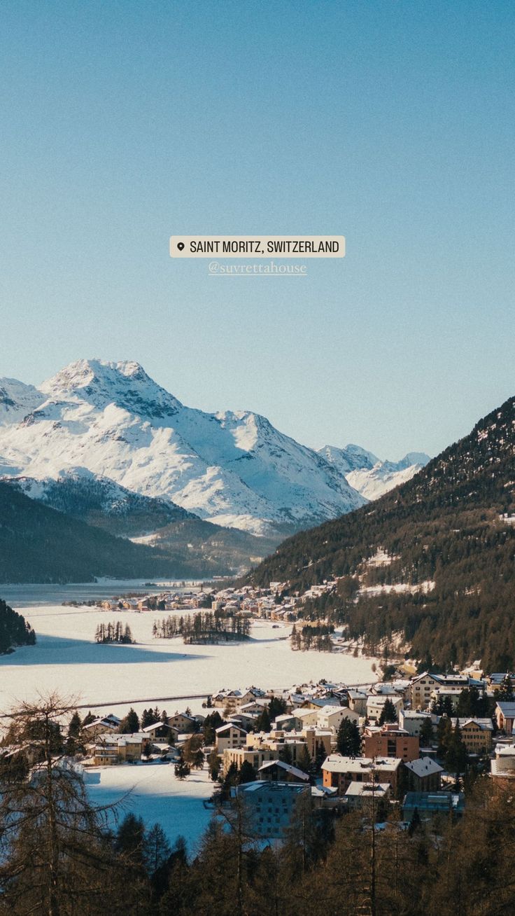 a scenic view of the mountains surrounding a town