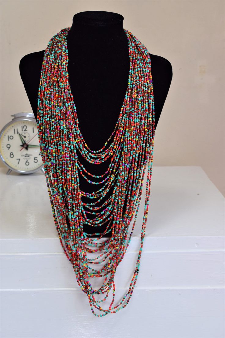 Unique African Maasai Handcrafted Beaded Necklace with an Elegant Look and Brilliant Finish. **GET FREE SHIPPING FOR ADDITIONAL ITEMS PURCHASED. Yes, Buy Multiple Items and pay shipping for 1 item only- The rest ships Free. (No Limits on the number of Multiple items). With a faster delivery time of 3 days via DHLExpress, Worldwide. Ordinary/Standard Shipping also available upon request. We Custom Make to Suit Your Taste. Available In All Colors and Sizes. For wholesale please chat me up for disc Bohemian Multi-strand Beaded Chain, Artisan Multicolor Multi-strand Beads, Artisan Multicolor Dangling Beads, Multicolor Round Beads Necklace For Festivals, Artisan Multicolor Multi-strand Beaded Necklaces, Bohemian Multi-strand Dangling Beads, Multicolor Round Beaded Necklaces For Festivals, Multicolor Beaded Necklaces For Festivals, Bohemian Multicolor Dangling Beads