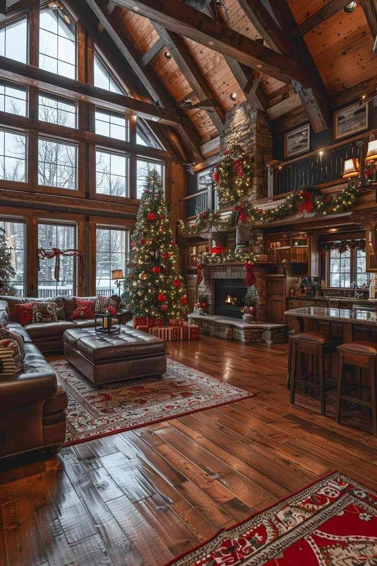 a living room filled with lots of furniture and christmas tree in the middle of it