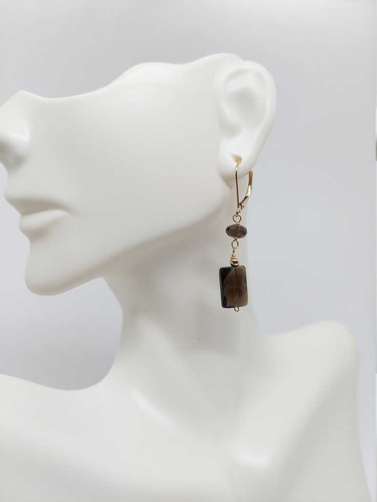 Smokey Quartz Dangle Earrings/ Gemstone Wire-Wrapped Earrings / 14k Solid Yellow Gold Lever back and gold beads Earring. Product Info: -Earring dimensions: 40mm -Metal: lever back 14k. -Stone and dimensions: Rectangular Faceted Smokey Quartz 10 x 7mm / Faceted Round Smokey Quartz 5mm / 14K Gold Beads 3mm -Stone: Smokey Quartz, -Finish: Solid Yellow Gold. -Handmade item. -Made in USA. -Nice Gift box is included. Elegant Gold Smoky Quartz Necklace, Brown Smoky Quartz Gemstone Jewelry, Luxury Smoky Quartz Jewelry, Smoky Quartz Earrings, Smoky Quartz Jewelry, Gold Bead Earrings, Earrings Gemstone, Wrapped Earrings, Wire Wrapped Earrings