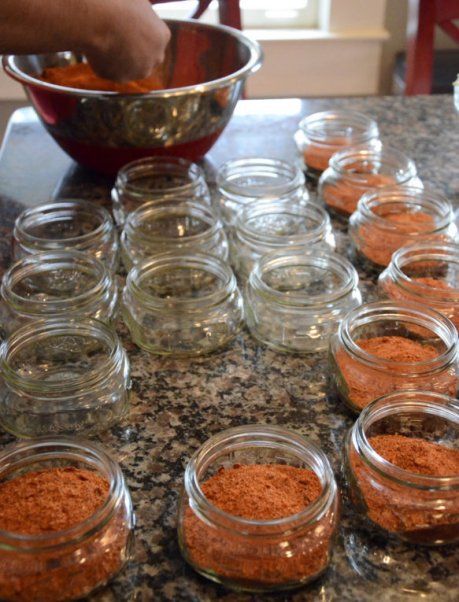 several jars filled with food sitting on top of a counter